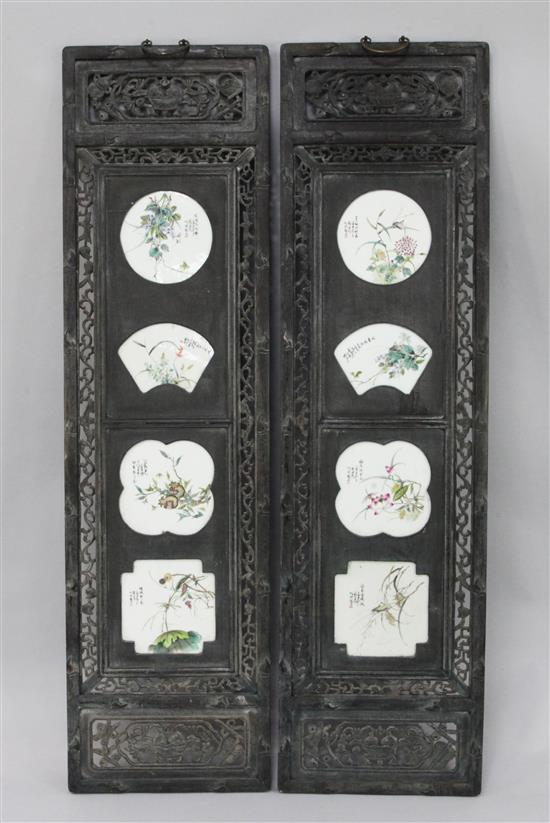 A pair of Chinese hardwood and porcelain mounted panels, 143.5 x 39.5cm.